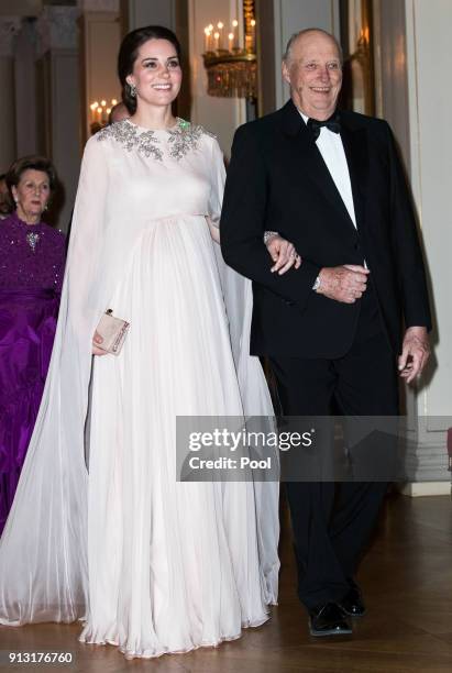 Catherine, Duchess of Cambridge and King Harald V of Norway attend dinner at the Royal Palace on day 3 of their visit to Sweden and Norway on...