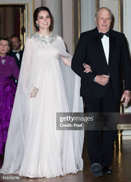 Catherine, Duchess of Cambridge and King Harald V of Norway attend dinner at the Royal Palace on day 3 of their visit to Sweden and Norway on...