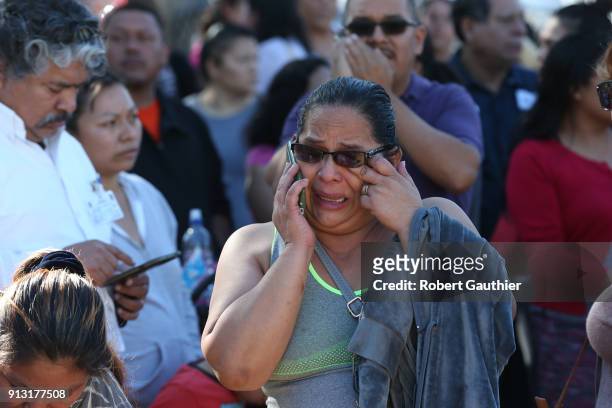 Rosa Soriano weeps as she attempts to locate her daughter outside the Belmont High School complex after a Castro Middle School student was shot,...
