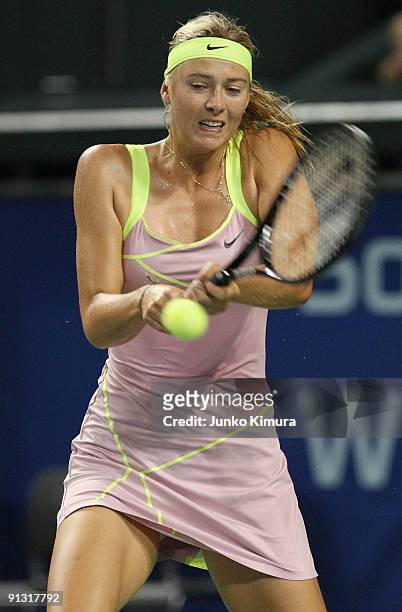 Maria Sharapova of Russia plays a backhand in her match against Agnieszka Radwanska of Poland during day six of the Toray Pan Pacific Open Tennis...