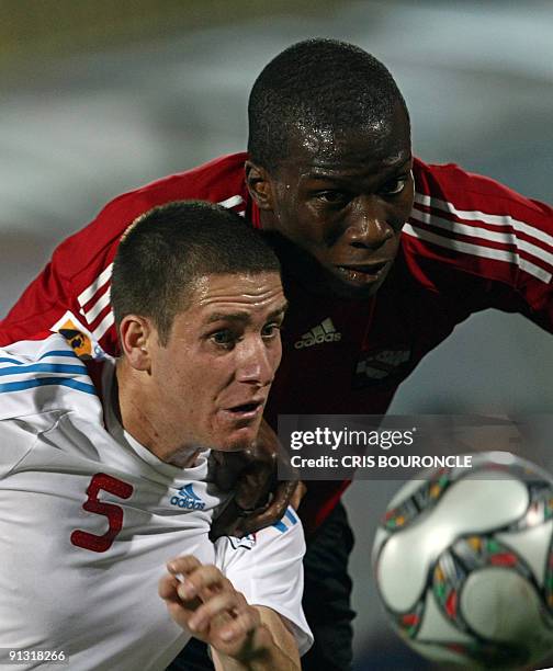 Paraguay�s defence Francisco Silva and Trinidad�s forward Jamaal Gay vie for the ball during the second half of the game played between Trinidad and...