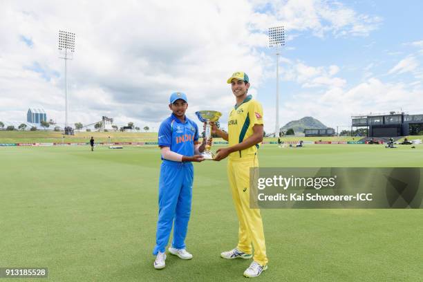 Captains Prithvi Shaw of India and Jason Sangha of Australia pose with the trophy during a pre-final media opportunity at Bay Oval on February 2,...