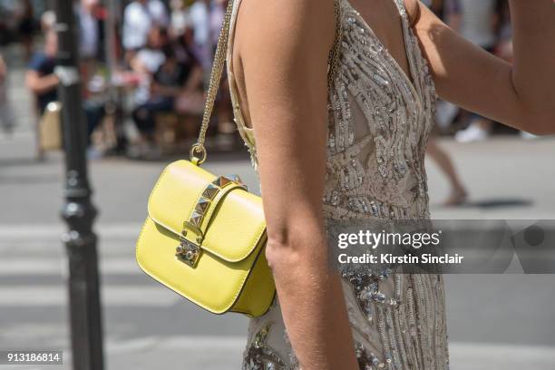 Founder & CEO of luxury beauty service Vensette Lauren Remington Platt wears a Valentino bag and a cream sequin dress day 4 of Paris Haute Couture...
