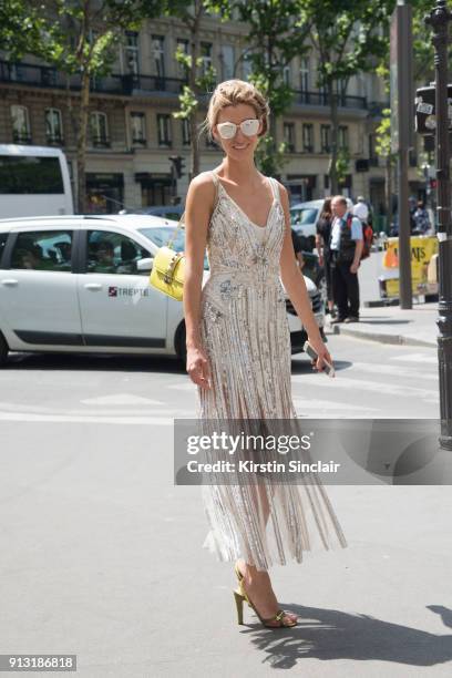 Founder & CEO of luxury beauty service Vensette Lauren Remington Platt wears a Valentino bag, Spectre sunglasses and a cream sequin dress day 4 of...