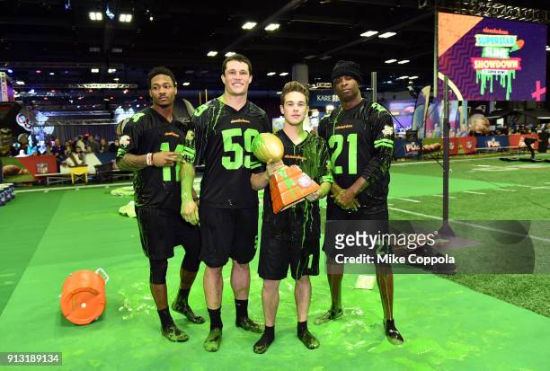 Players Stefon Diggs, Luke Kuechly, actor Ricardo Hurtado and former NFL player Deion Sanders attend the Superstar Slime Showdown taping at...