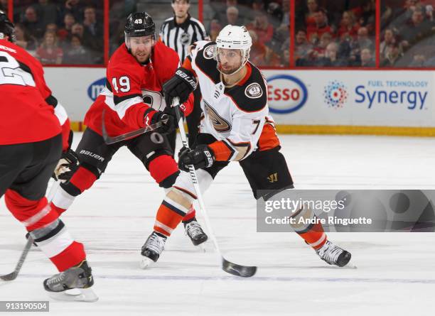 Christopher DiDomenico of the Ottawa Senators defends against pass attempt by Andrew Cogliano of the Anaheim Ducks at Canadian Tire Centre on...