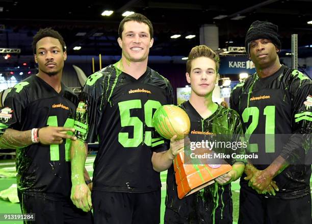 Players Stefon Diggs, Luke Kuechly, actor Ricardo Hurtado and former NFL player Deion Sanders attend the Superstar Slime Showdown taping at...