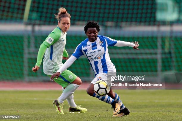 Babett Peter of VfL Wolsburg Women Chalenges Genevive Ngo Mbeleck of SC Huelva during the friendly match between VfL Wolfsburg Women's and SC Huelva...