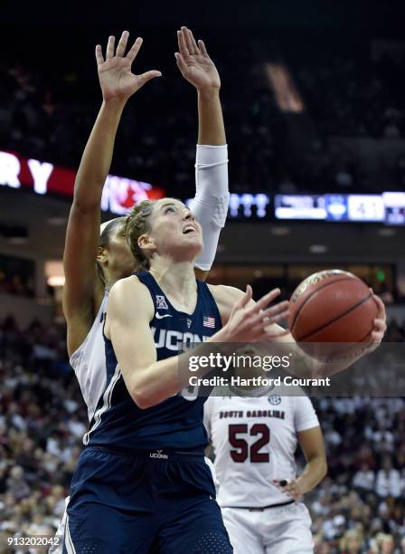 Connecticut's Katie Lou Samuelson drives to the hoop against South Carolina's A'ja Wilson in the first half at Colonial Life Arena in Columbia, S.C.,...