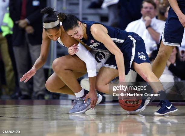 Connecticut's Kia Nurse fights for a loose ball against South Carolina's A'ja Wilson, left, in the first half at Colonial Life Arena in Columbia,...