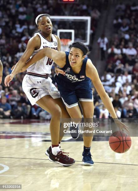 Connecticut's Napheesa Collier, right, drives around South Carolina's Bianca Jackson in the second half at Colonial Life Arena in Columbia, S.C., on...