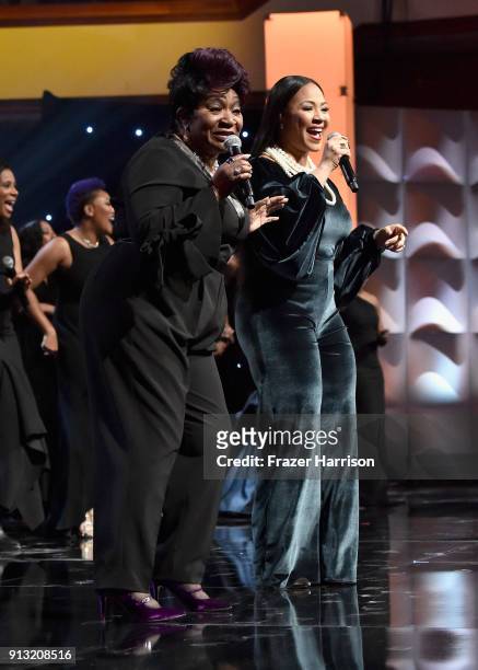 Ann Nesby and Erica Campbell perform with Sounds of Blackness onstage during BET Presents 19th Annual Super Bowl Gospel Celebration at Bethel...