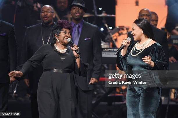 Ann Nesby and Erica Campbell perform with Sounds of Blackness onstage during BET Presents 19th Annual Super Bowl Gospel Celebration at Bethel...