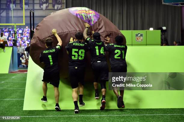 Actor Ricardo Hurtado, NFL players Luke Kuechly, Stefon Diggs and former NFL player Deion Sanders attend the Superstar Slime Showdown taping at...