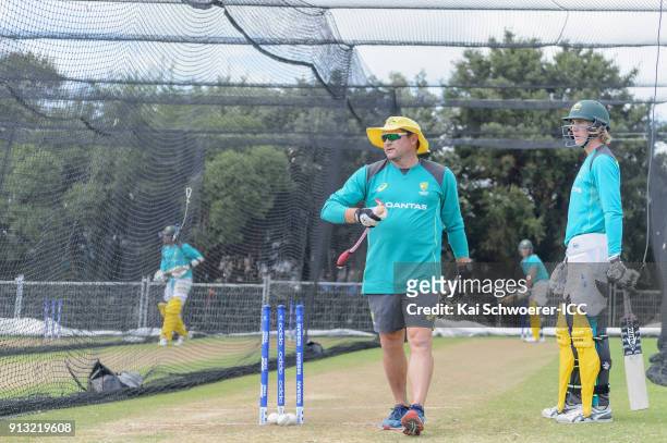 Head Coach Ryan Harris of Australia and Will Sutherland of Australia look on during an Australian training session at Bay Oval on February 2, 2018 in...