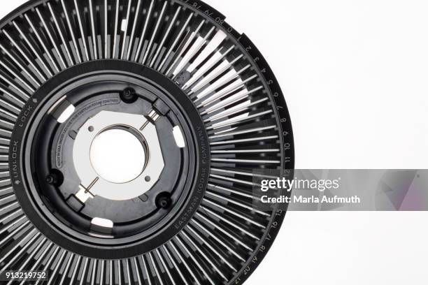 close-up of a slide carousel for a slide projector on a white background. - diaprojektor stock-fotos und bilder
