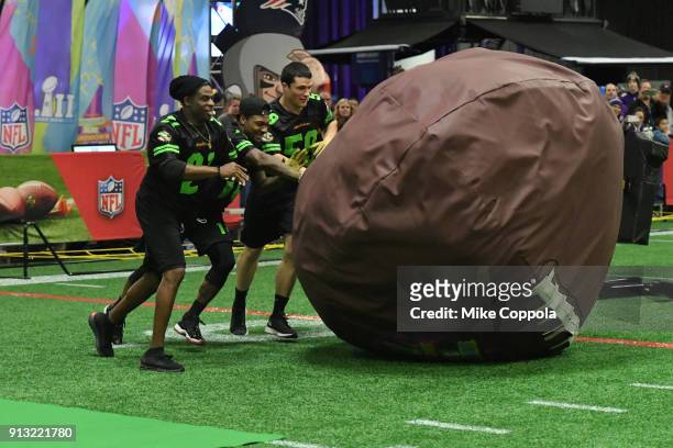 Former NFL player Deion Sanders and NFL players Stefon Diggs and Luke Kuechly attend the Superstar Slime Showdown taping at Nickelodeon at the Super...