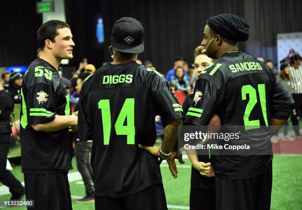 Players Luke Kuechly and Stefon Diggs, actor Ricardo Hurtado and former NFL player Deion Sanders attend the Superstar Slime Showdown taping at at the...