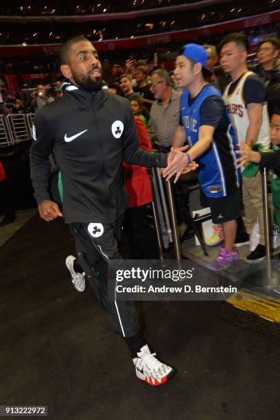 Kyrie Irving of the Boston Celtics shakes hands with fans before the game against the LA Clippers on January 24, 2018 at STAPLES Center in Los...