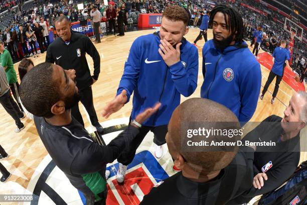 Kyrie Irving of the Boston Celtics and Blake Griffin with DeAndre Jordan of the LA Clippers shake hands before the game on January 24, 2018 at...