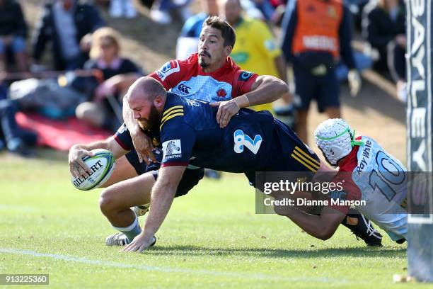 Greg Pleasants-Tate of the Highlanders dives over to score a try during the Super Rugby pre-season match between the Highlanders and the Waratahs on...