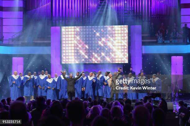 Donnie McClurkin performs with Members of the NFL Players Choir onstage during BET Presents 19th Annual Super Bowl Gospel Celebration at Bethel...