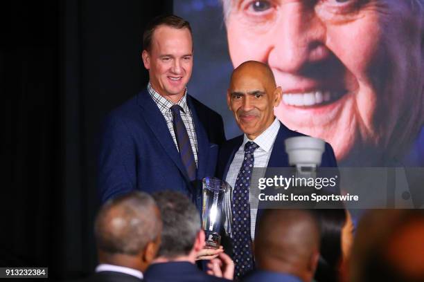 Peyton Manning poses with Tony Dungy the Pat Summerall Award winner during the Legends for Charity Dinner during Super Bowl LII week on February 1 at...