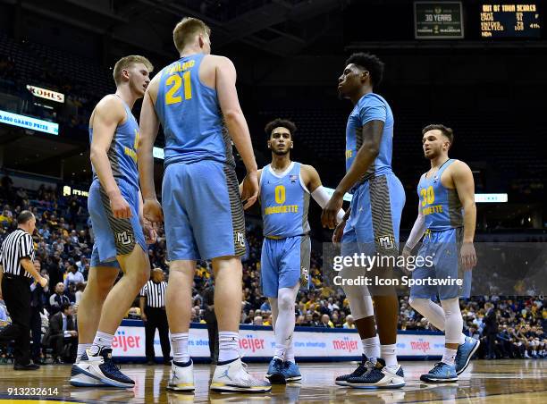 Marquette Golden Eagles guard Markus Howard , Marquette Golden Eagles guard Sam Hauser , Marquette Golden Eagles center Harry Froling , Marquette...