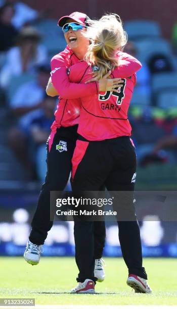 Kim Garth of the Sydney Sixers celebrates after taking the wicket of Sophie Devine of the Adelaide Strikers during the Women's Big Bash League match...