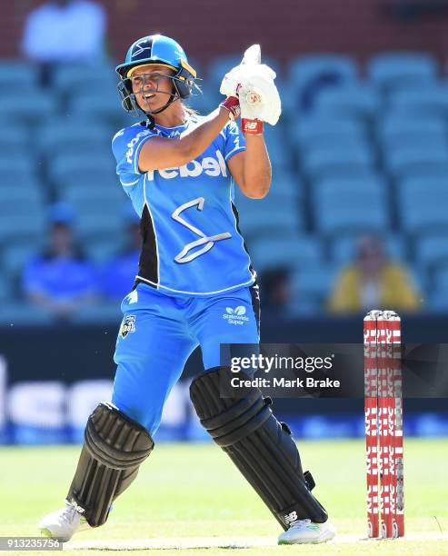 Suzie Bates of the Adelaide Strikers hits in the air and is caught by Lauren Smith of the Sydney Sixers during the Women's Big Bash League match...