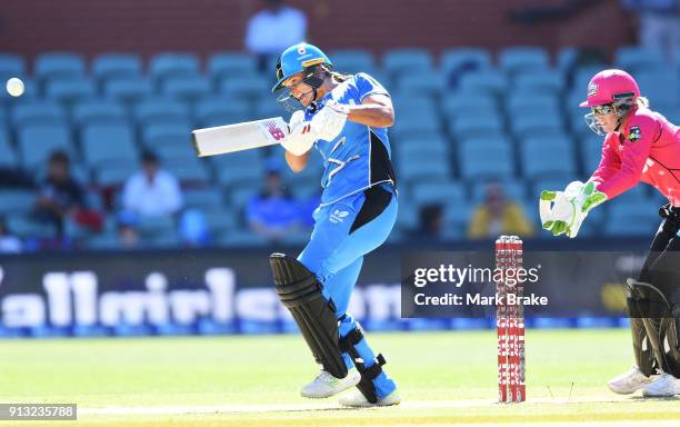 Suzie Bates of the Adelaide Strikers hits in the air and is caught by Lauren Smith of the Sydney Sixers during the Women's Big Bash League match...