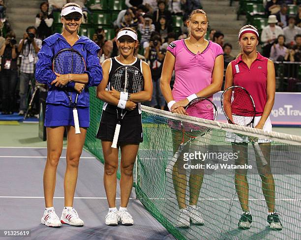 Daniela Hantuchova of Slovakia and Ai Sugiyama of Japan and Nadia Petrova of Russia and Gisela Dulko of Argentina pose before their doubles match...