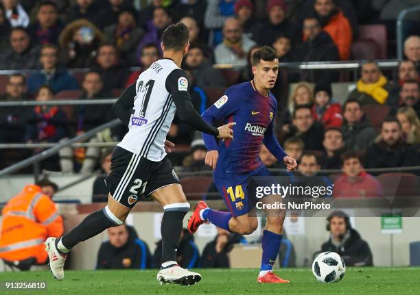 Philippe Coutinho of FC Barcelona and Martin Montoya of Valencia CF during the spanish Copa del Rey semi-final, first leg match between FC Barcelona...