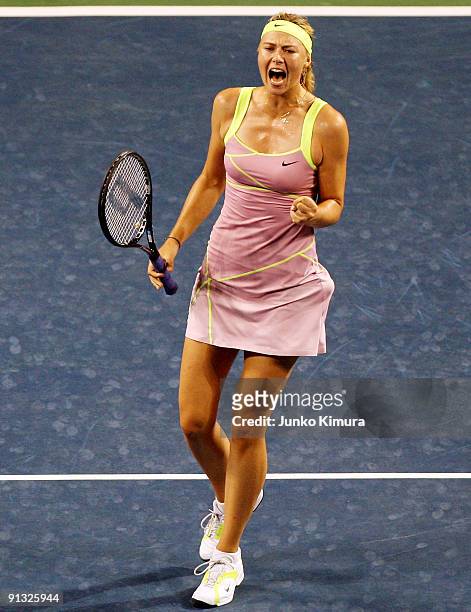 Maria Sharapova of Russia celebrates in her match against Agnieszka Radwanska of Poland during day six of the Toray Pan Pacific Open Tennis...