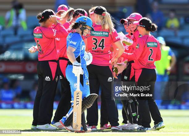 Sydney Sixers celebrate the wicket of Tabatha Saville of the Adelaide Strikers during the Women's Big Bash League match between the Adelaide Strikers...