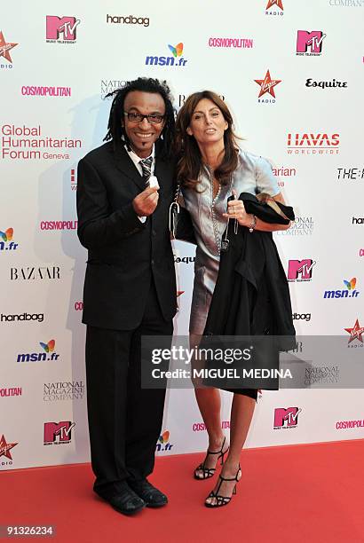 French drummer Manu Katche poses with his wife Laurence on October 01, 2009 in Paris, prior to attend the launch by Former UN chief Kofi Annan of a...