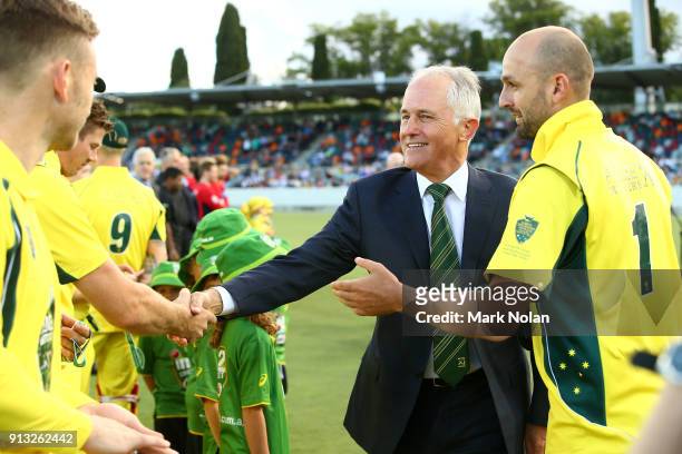 Captain Nathan Lyon introduces the Australian Prime Minister Malcom Turnbull to the team before the One Day Tour Match between the Prime Minister's...