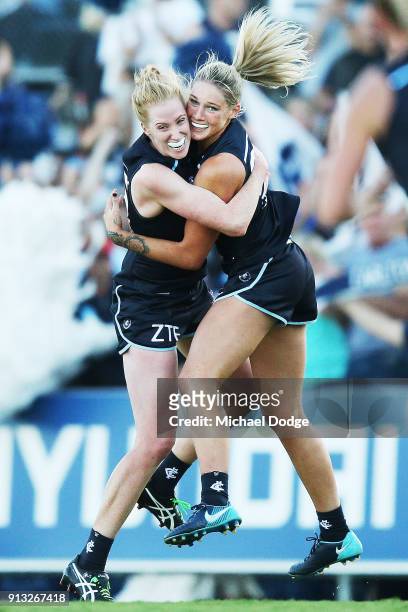 Tayla Harris of the Blues celebrates a goal with Kate Shierlaw during the round one AFLW match between the Carlton Blues and the Collingwood Magpies...
