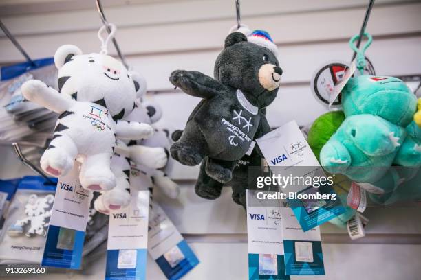 Souvenir keychains featuring 2018 PyeongChang Winter Olympic Games mascots Soohorang, left, and Paralympic Games mascot Bandabi, center, are...