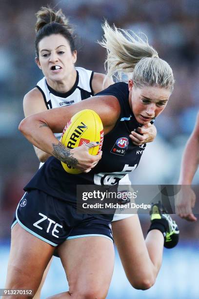 Stephanie Chiocci of the Magpies tackles Tayla Harris of the Blues during the round one AFLW match between the Carlton Blues and the Collingwood...