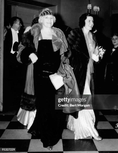 American socialites Grace Wilson Vanderbilt and Anne Gordon Colby Vanderbilt smile as they attend opening night of the Metropolitan Opera season, New...