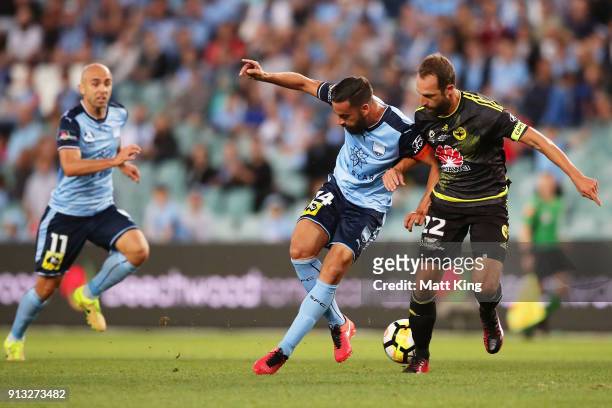 Alex Brosque of Sydney FC passes to Adrian Mierzejewski of Sydney FC during the round 19 A-League match between Sydney FC and the Wellington Phoenix...