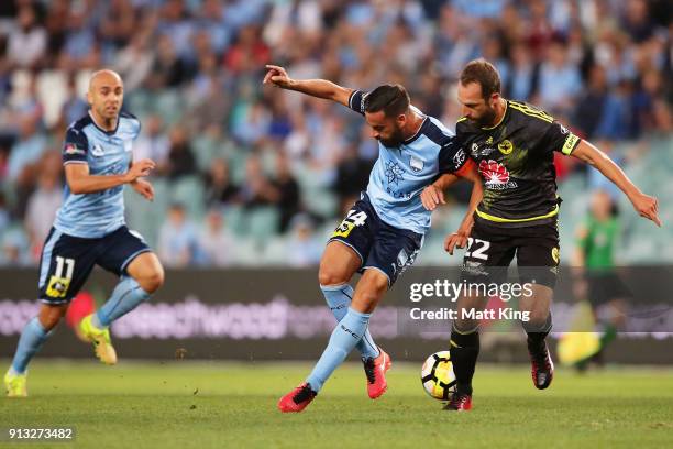 Alex Brosque of Sydney FC passes to Adrian Mierzejewski of Sydney FC during the round 19 A-League match between Sydney FC and the Wellington Phoenix...