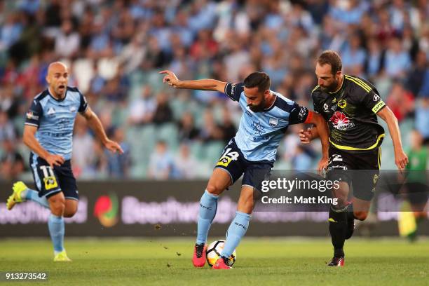 Alex Brosque of Sydney FC passes to Adrian Mierzejewski of Sydney FC during the round 19 A-League match between Sydney FC and the Wellington Phoenix...