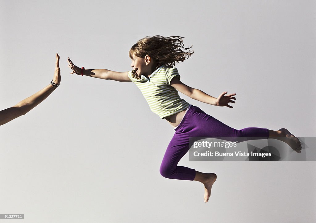 Young girl jumping