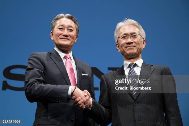 Kazuo Hirai, incoming chairman of Sony Corp., left, and Kenichiro Yoshida, incoming chief executive officer, shake hands while posing for photographs...