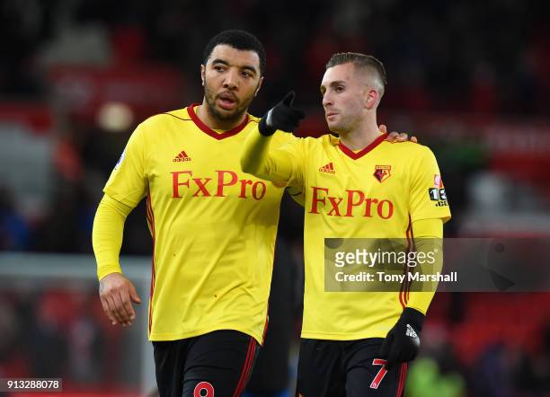 Troy Deeney and Gerard Deulofeu of Watford during the Premier League match between Stoke City and Watford at Bet365 Stadium on January 31, 2018 in...
