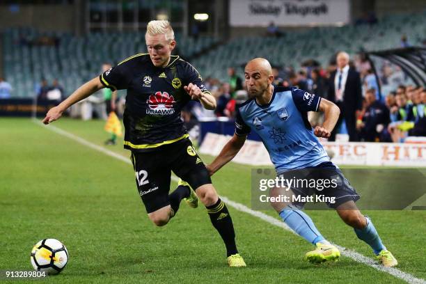 Adrian Mierzejewski of Sydney FC competes for the ball against Adam Parkhouse of Wellington Phoenix during the round 19 A-League match between Sydney...