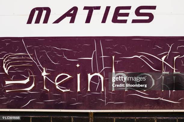 Peeling weather damaged Steinhoff International Holdings NV sign sits in storage at the University of Stellenbosch sports field in Stellenbosch,...