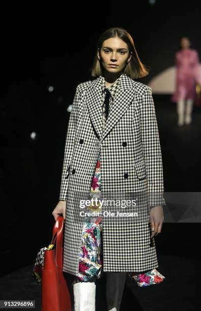 Model walks the runway at the Baum und Pferdgarten show during the Copenhagen Fashion Week Autumn/Winter18 on February 1, 2018 in Copenhagen, Denmark.